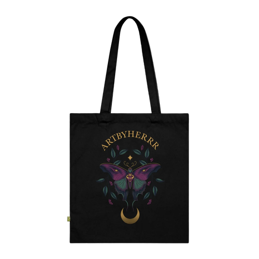 Black tote bag with a butterfly design and 'ARTBYHERRR' branding on a black background